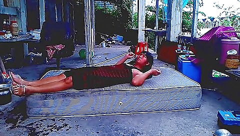 Asian beauty taking pictures outdoors and riding on her knees