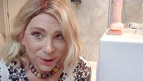 Blonde milf in stockings gets a dildo in her asshole